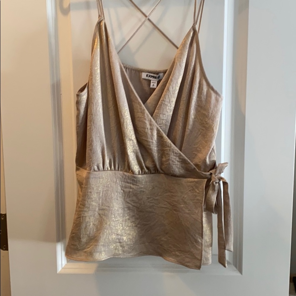 Beige/gold going out top.